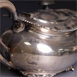 Victorian four piece silver tea service, comprising teapot, hot water pot, open sucrier and cream jug, each of baluster form and decorated with a frieze of neo-classical figures on a textured ground, the teapot and hot water pot with Roman helmet finials and ivory insulated handles, Roberts & Belk, Sheffield 1872, tallest including handle H32cm