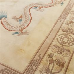Late 20th century Chinese wool carpet, cream field with five stylized dragons arranged in a circular formation around a central flaming pearl motif, dragons depicted with elongated bodies and clawed feet amongst stylized cloud forms, enclosed within a narrow inner border and a wider outer border decorated with traditional Chinese motifs and symbols
