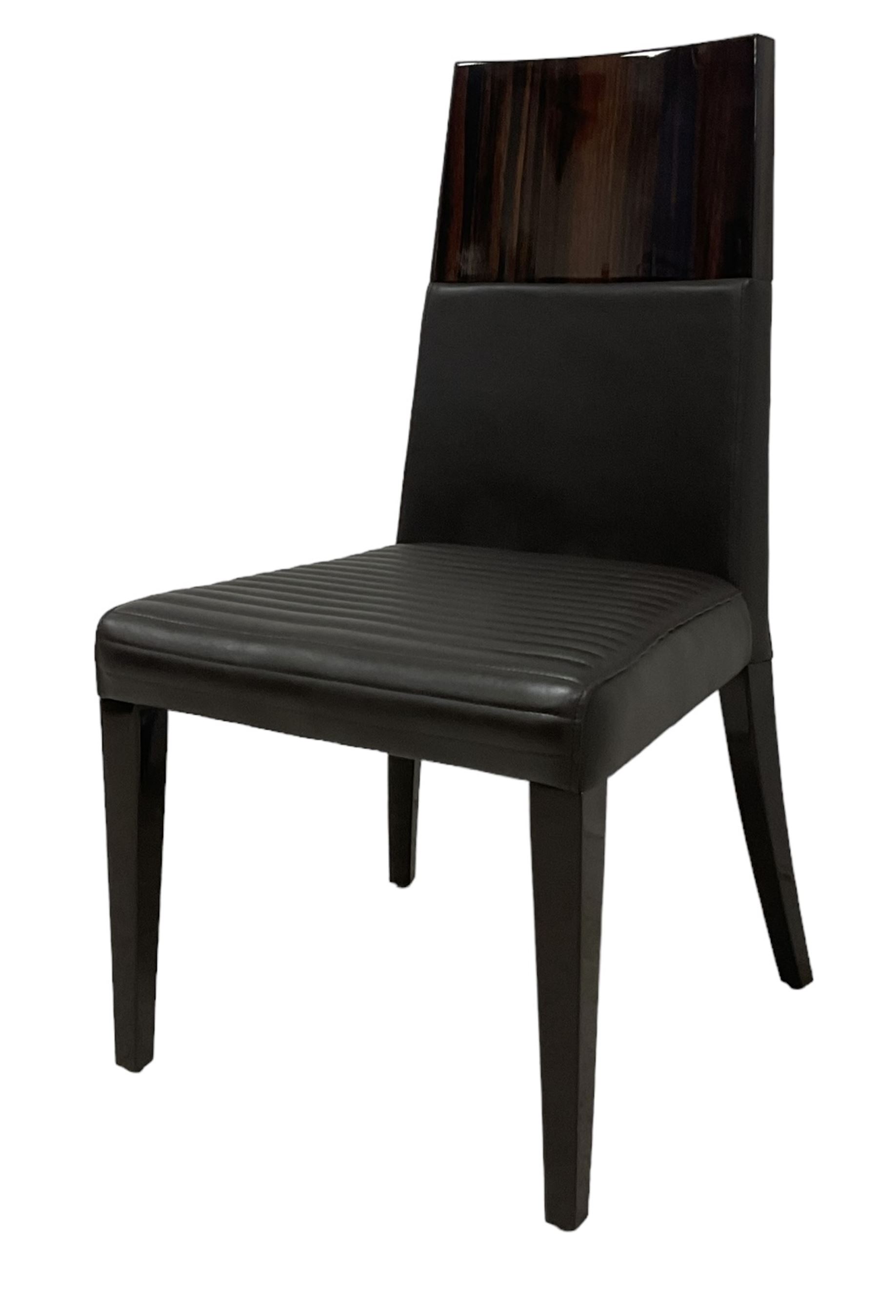 Giorgio Collection - Art Deco design macassar ebony 'Luna' extending dining table, oval top with quarter-matched veneer and stringing, raised on a curved V-shaped pedestal with oval base; with matching set of dining chairs, high macassar ebony back, the lower half and seat upholstered in black leather, on ebonised tapering supports, retailed by Harrods