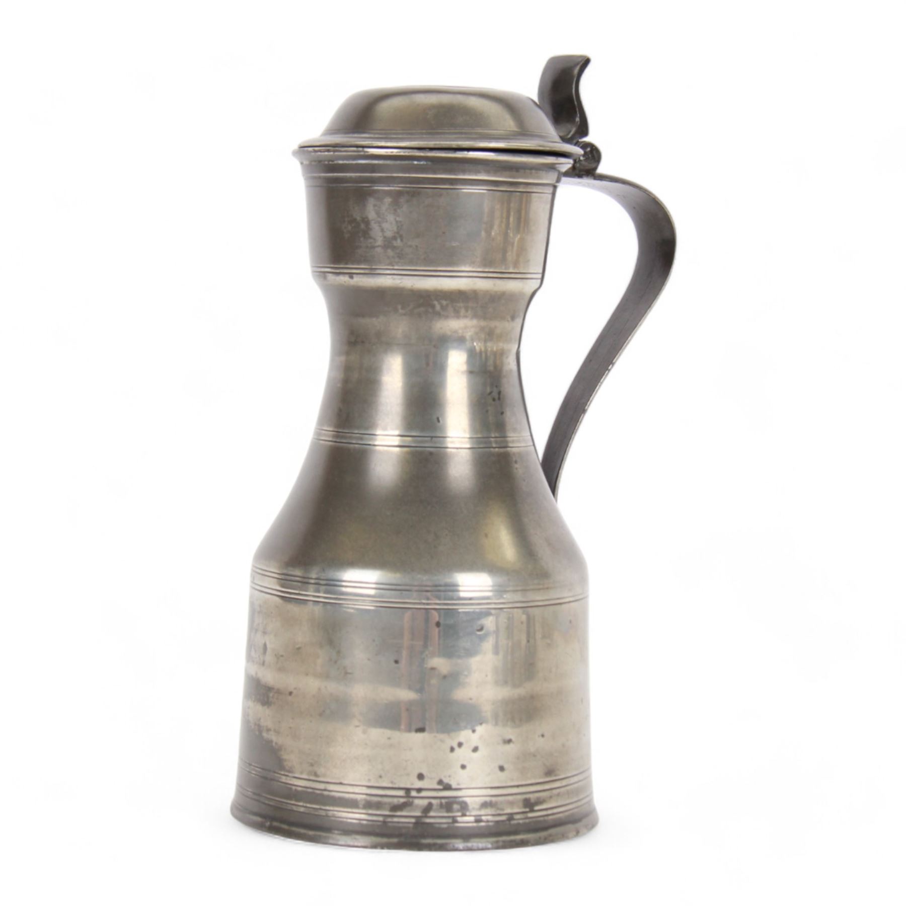 George III pewter tappit hen, circa 1800, the body of typical shouldered form, with bands of incised lines, curved flat thumbpiece, and curved strap handle, bearing indistinct touch marks along collar, including thumb piece H26.5cm, 