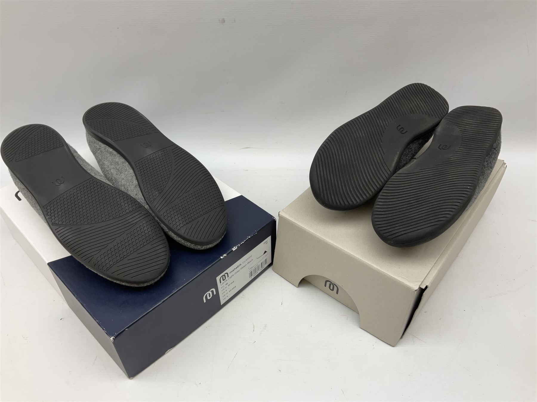 Two pairs of Mahabis slippers, comprising Mahabis curve grey and black slippers size EU42 and Mahabis classic grey and black slippers, both new in box