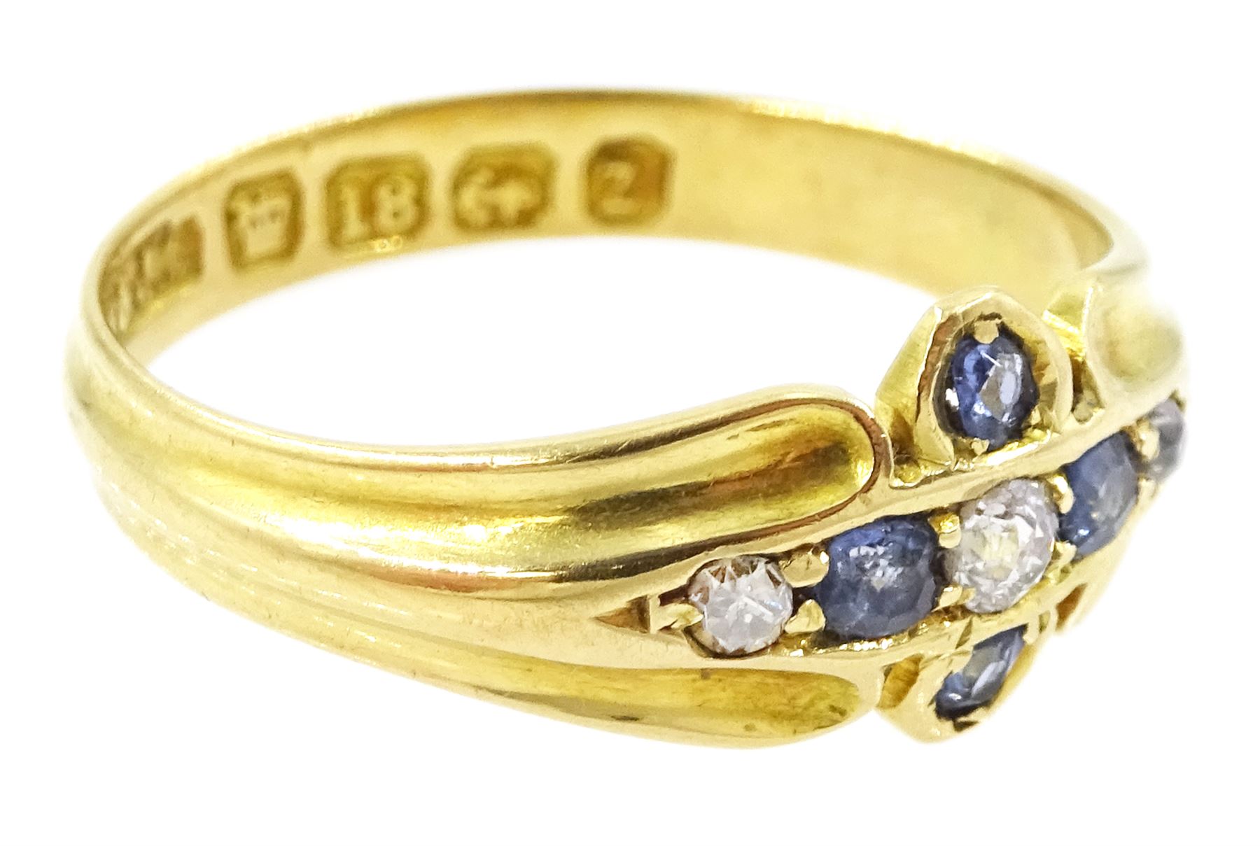 Victorian 18ct gold sapphire and diamond ring, three old cut and single cut diamonds, the principal diamond with four oval cut sapphire surround, to a ridged design shank, Birmingham 1899