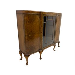 Mid 20th century figured walnut display cabinet, curved ends with centre glazed door, on cabriole feet