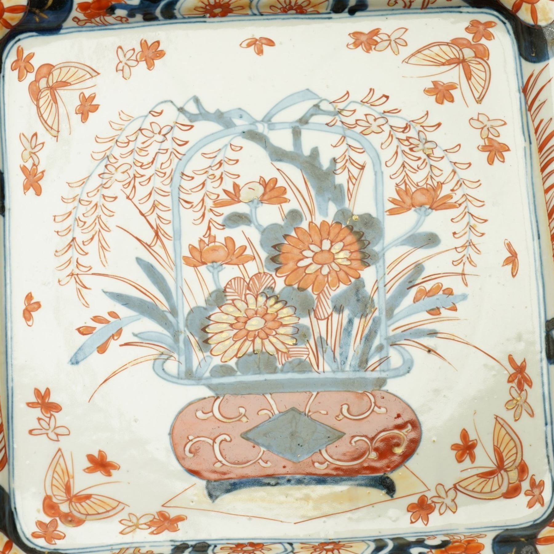 Late 19th/early 20th century Japanese Imari square dish decorated with flowers 32cm and an Indian linen wall hanging decorated with elephants, carriages etc in procession 56cm x 170cm