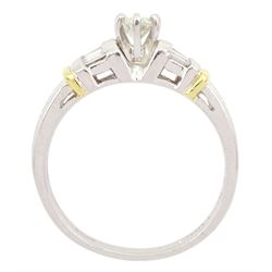 Platinum and 18ct gold single stone round brilliant cut diamond ring, with three baguette cut diamonds set each side, London 2016, total diamond weight approx 0.45 carat