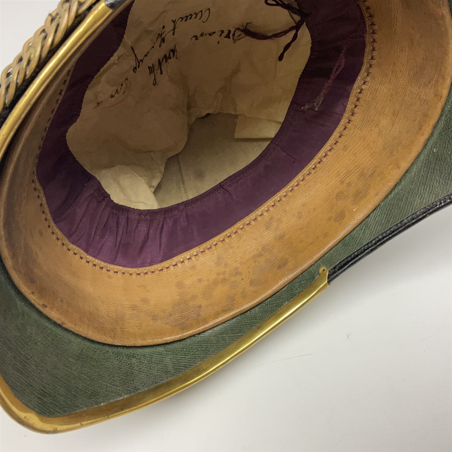 Late Victorian North Staffordshire Regiment Officer's Home Service Blue Cloth Helmet, having incorrect other ranks gilt metal Queen's crown helmet plate to the front with later leather backing, removable spike to the top on a shaped cruciform base with rosette fittings, rosette side bosses, brass trim to the front peak, and leather and velvet backed chin scales, with leather sweat band, the interior with makers stamp for Hawkes & Co 14 Piccadilly London