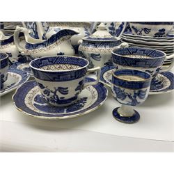 Booths Real Old Willow pattern part tea and dinner service, to include two meat platters, cake stand, teapot, two jugs, sugar bowl, sauce boat, teacups and saucers and a collection of plates and bowls