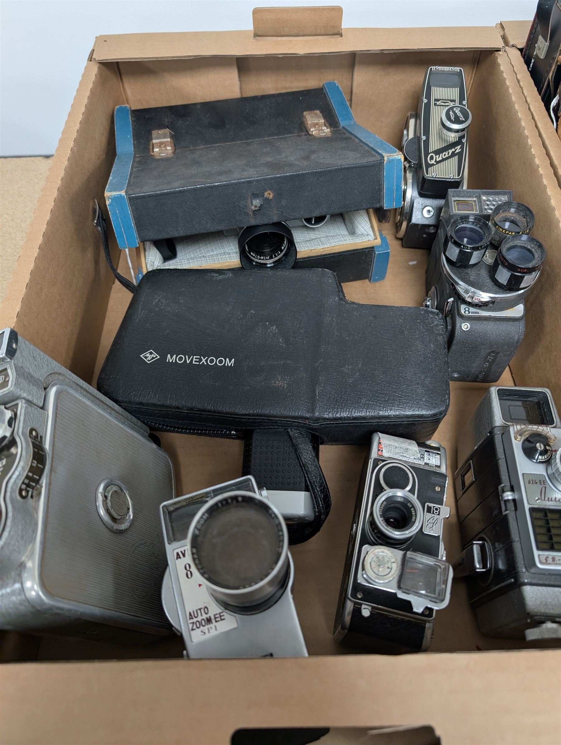Collection of vintage cine cameras, including Bolex Paillard B8L, Mansfield Holiday Meter Matic, Quarz, Bell & Howell Autoset, Sankyo Super Micro, Canon Demi C, Agfa Movexoom, etc