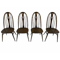 Ercol dark elm drop leaf dining table and four Swan back chairs
