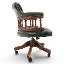 Captains swivel desk chair upholstered in buttoned green leather, five point star base raised on castors