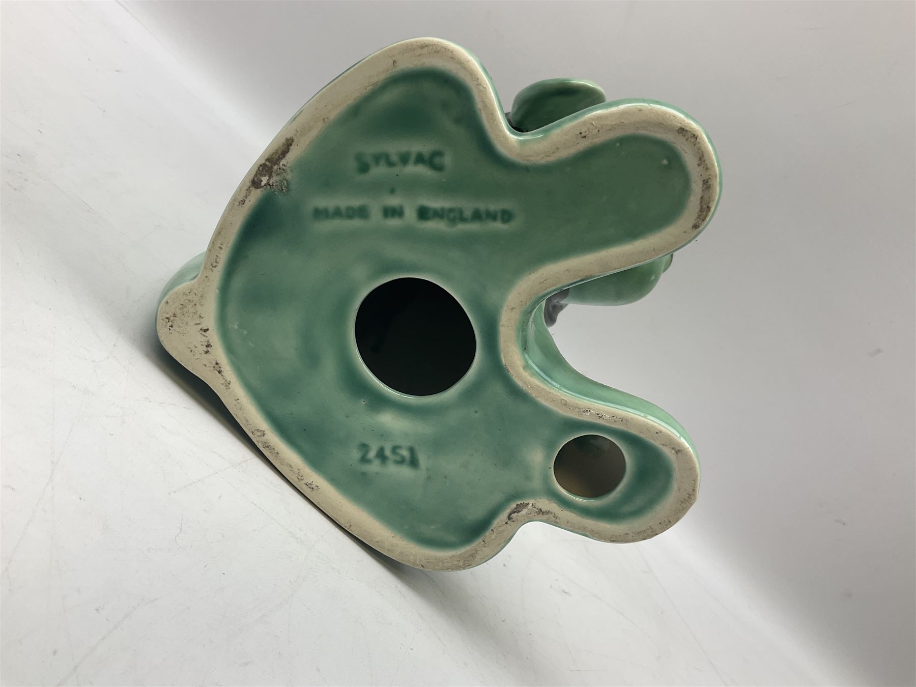 Sylvac 'toothache' dog in the green colourway, no 2451, with impressed beneath, H28.5cm