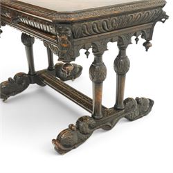 Victorian Jacobean Revival heavily carved oak centre table , rectangular top with canted corners and carved edge, fitted with single frieze drawer with central carved green-man handle with flanking gadrooning, the corners with lion masks, raised on fluted supports terminating to splayed stylised dolphin feet with castors, united by stretcher