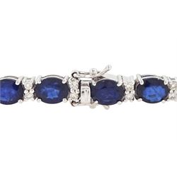 18ct white gold sapphire and diamond bracelet, twenty-six oval cut sapphires, each spaced by two round brilliant cut diamonds, stamped 750, total sapphire weight 10.60 carat, total diamond weight 0.46 carat
