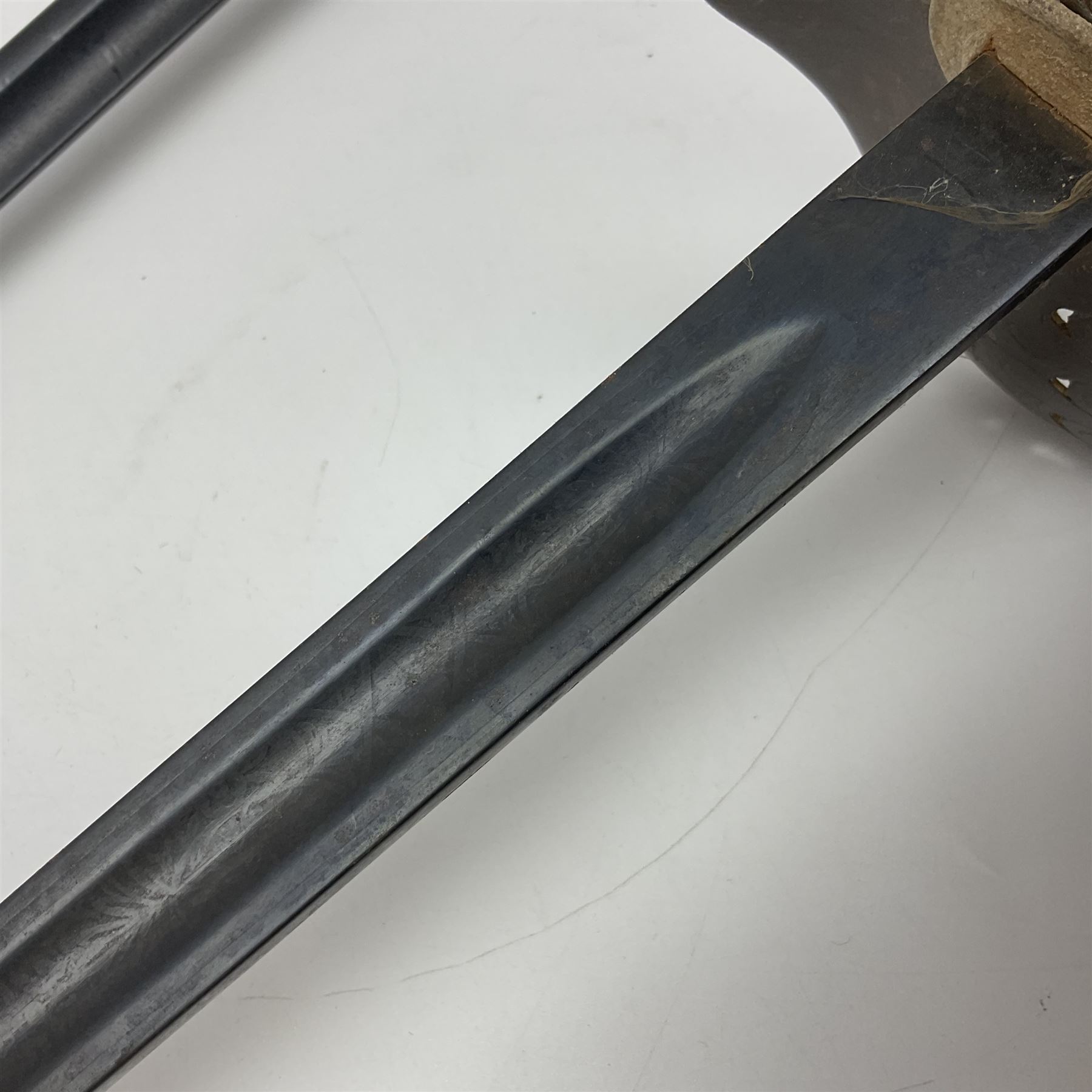 WW1 British Army 1897 Pattern Officers Sword, the 80cm fullered steel blade with traces of decoration and inscribed 'W.E. French 1914'; the basket hilt pierced with the George V cypher and wire-bound fish-skin grip L97cm overall; and WW1 British 1821 pattern Royal Artillery officer's sword with three-bar hilt; both lacking scabbard (2)