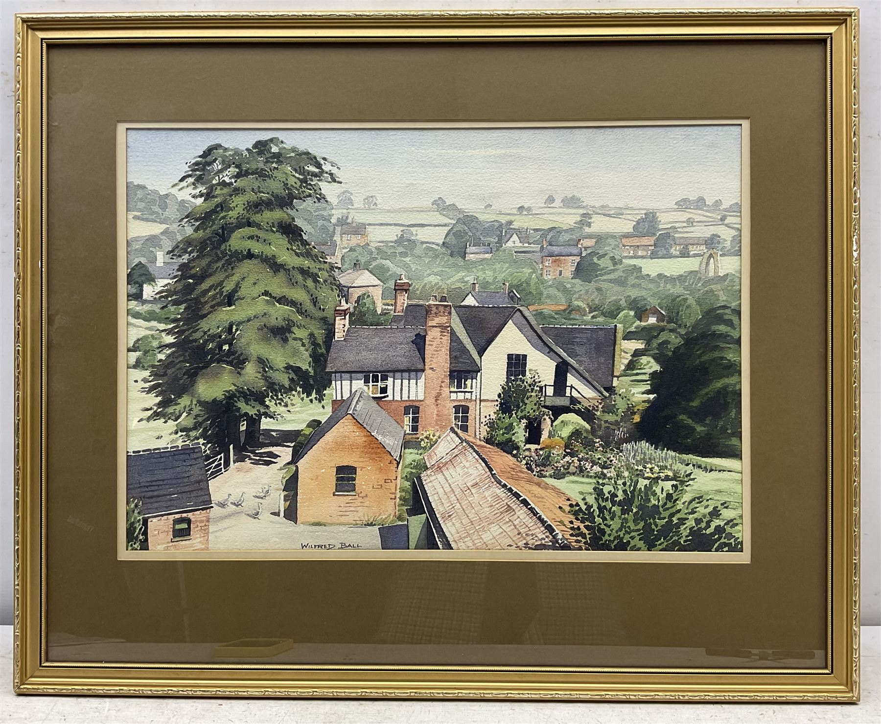 Wilfred Ball (British 1917-2000): 'Church Farm - Dale Abbey' and A Winter Townscape, two watercolours signed, one titled verso 34cm x 50cm (2)