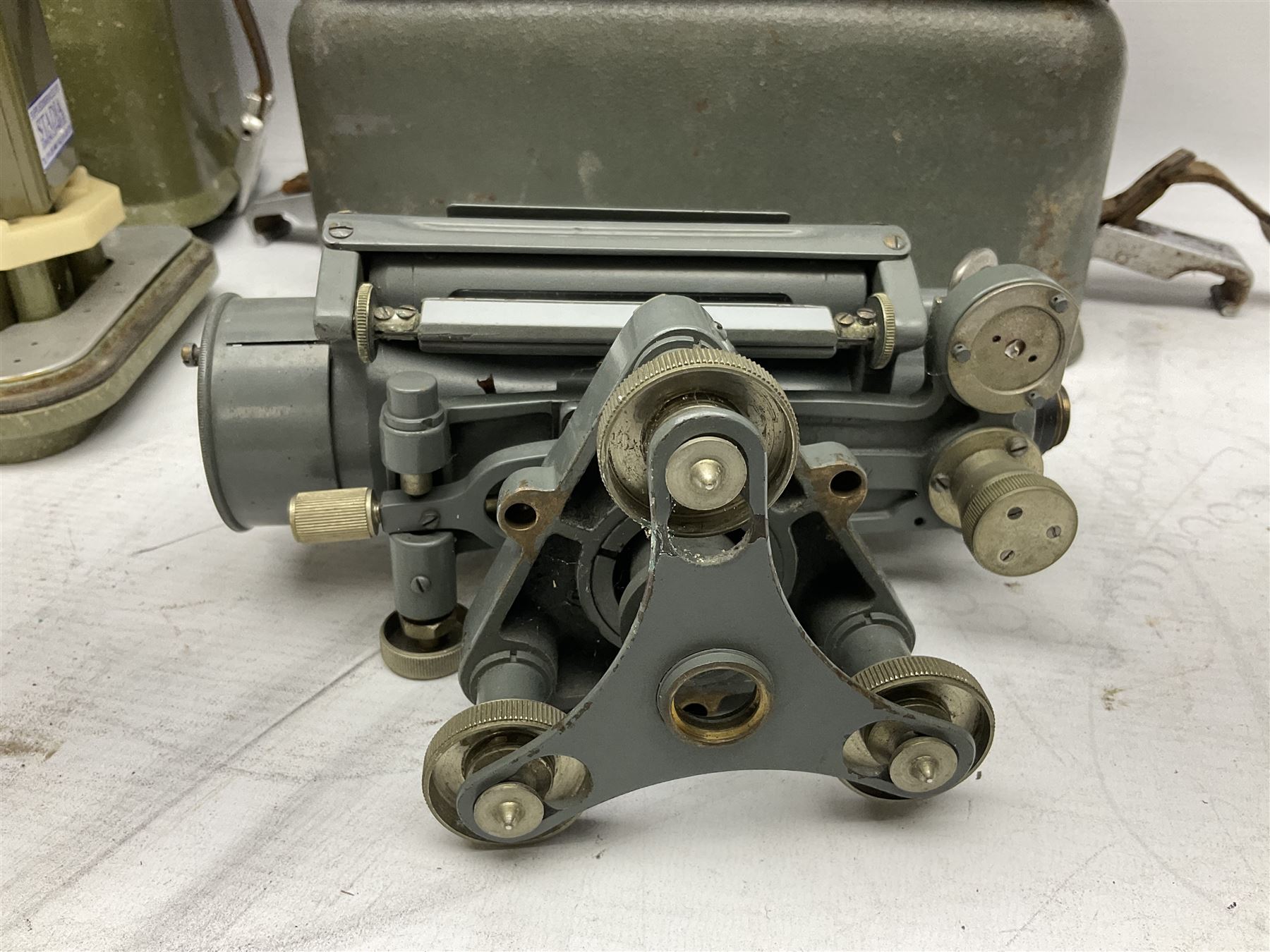 Swiss Kern K1-RA engineer's self-reducing tachymeter theodolite, serial no.197914, with metal cover; Hilger & Watts Ltd. theodolite, serial no.114671, with tool set and metal over; Cooke Troughton & Simms Ltd. tilting level, serial no.SO377O3; uncased; and mahogany hinged  measuring staff (4)