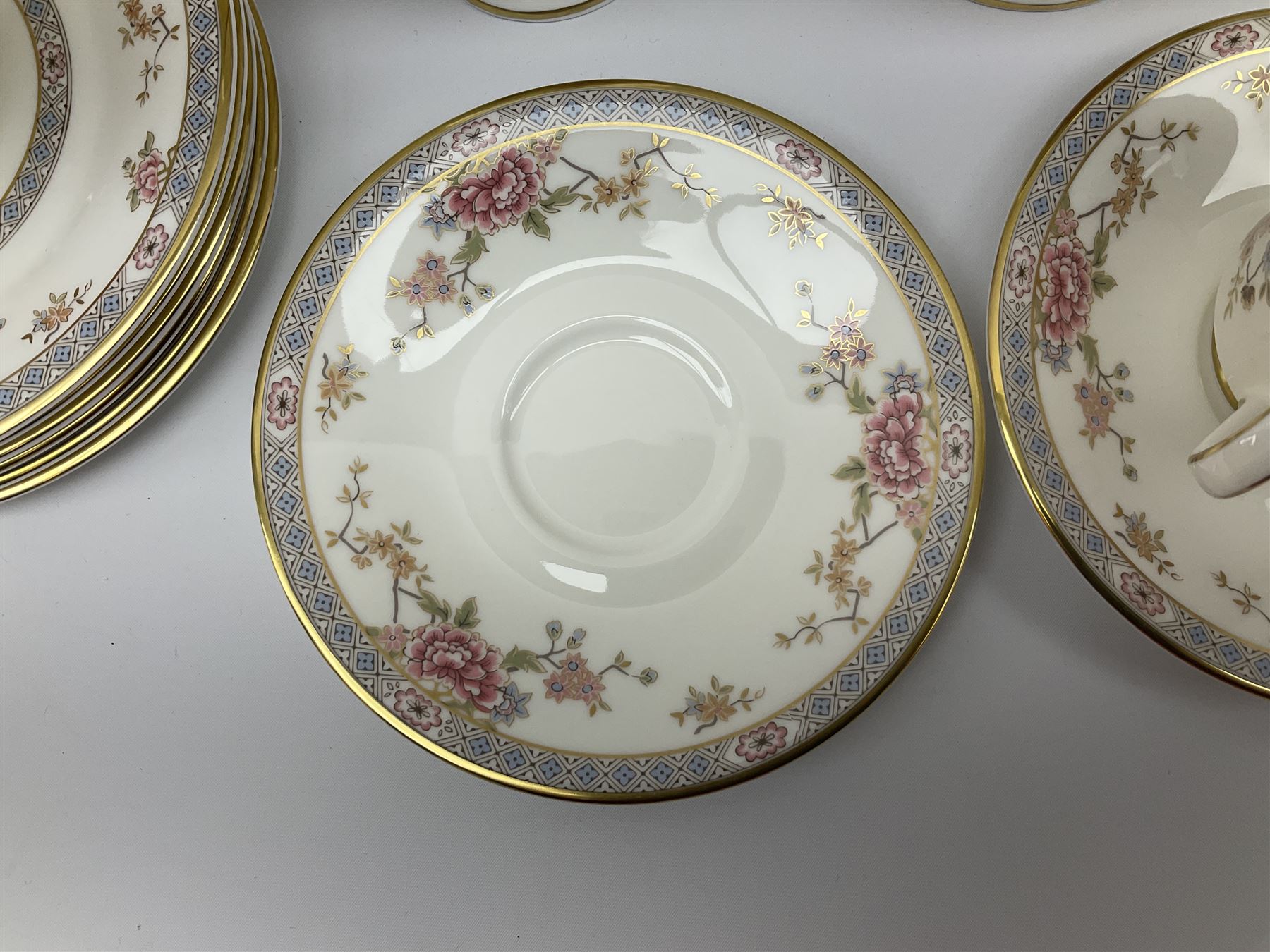 Wedgwood Queens Ware tea and dinner wares in Provence pattern, including ten cups and saucers, milk jug, butter dish with cover, ten dinner plates, ten bowls and ten side plates etc (71), together with Royal Doulton tea wares in Canton pattern, comprising six cups and saucers, milk jug, open sucrier and six dessert plates.    