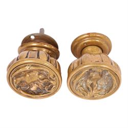 Late 19th century brass door knob set and brass letter box cover for Phoenix Assurance Company Limited, the door knobs each cast with fluted sides, the fronts with deep cast phoenix, square spindle shaft, each approximately L7.5cm, the letter box cover inscribed Phoenix beneath rectangular letter recess and flap, 19cm x 28cm