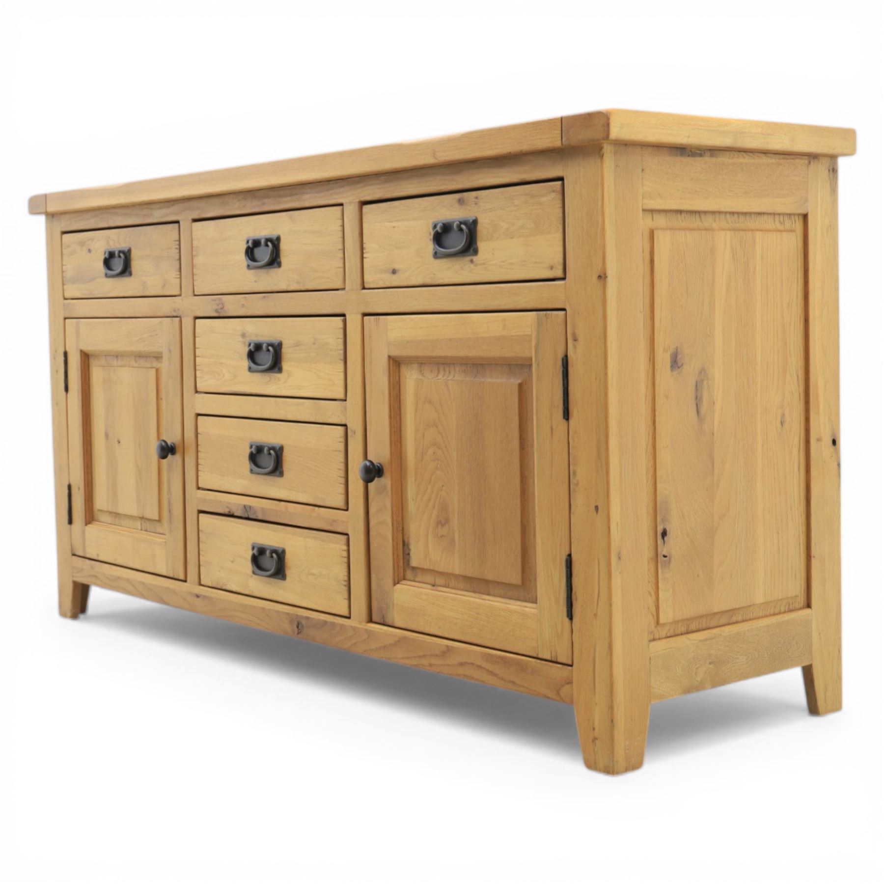 Modern light oak sideboard, fitted with six drawers and two cupboards