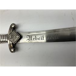 German Reichsarbeitdienst RAD Leader's Hewer dagger, the 26cm single edged scimitar shaped blade with narrow fuller, etched Arbeit adelt; by E.D. Wusthof, Solingen; the aluminium hilt with spade and wheat ear langet; two piece white plastic grip and eagle head pommel; pebbled steel scabbard engraved with ears of wheat and strapwork with double leather hangers L40cm overall
