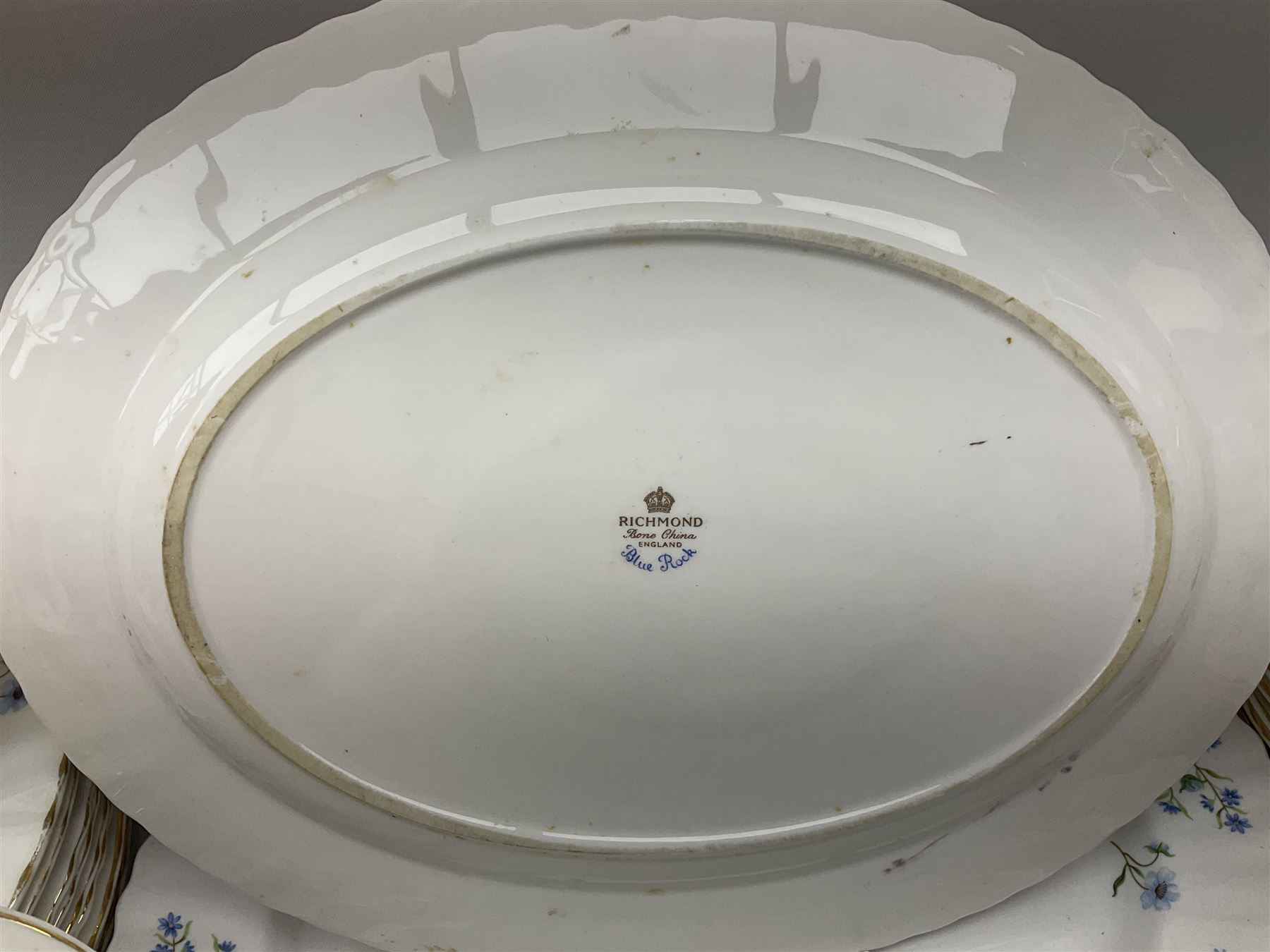 Extensive Richmond Blue Rock pattern part tea and dinner service, to include seven dinner plates, nine smaller plates, three lidded twin handled tureens, two teapots and two coffee pots, eleven bowls, cake stand, six twin handled soup bowls and saucers, six teacups, four coffee cups, milk jugs, sucrier, cake plate, salt and pepper shakers, other plates, dishes, bowls, side plates and many spares etc