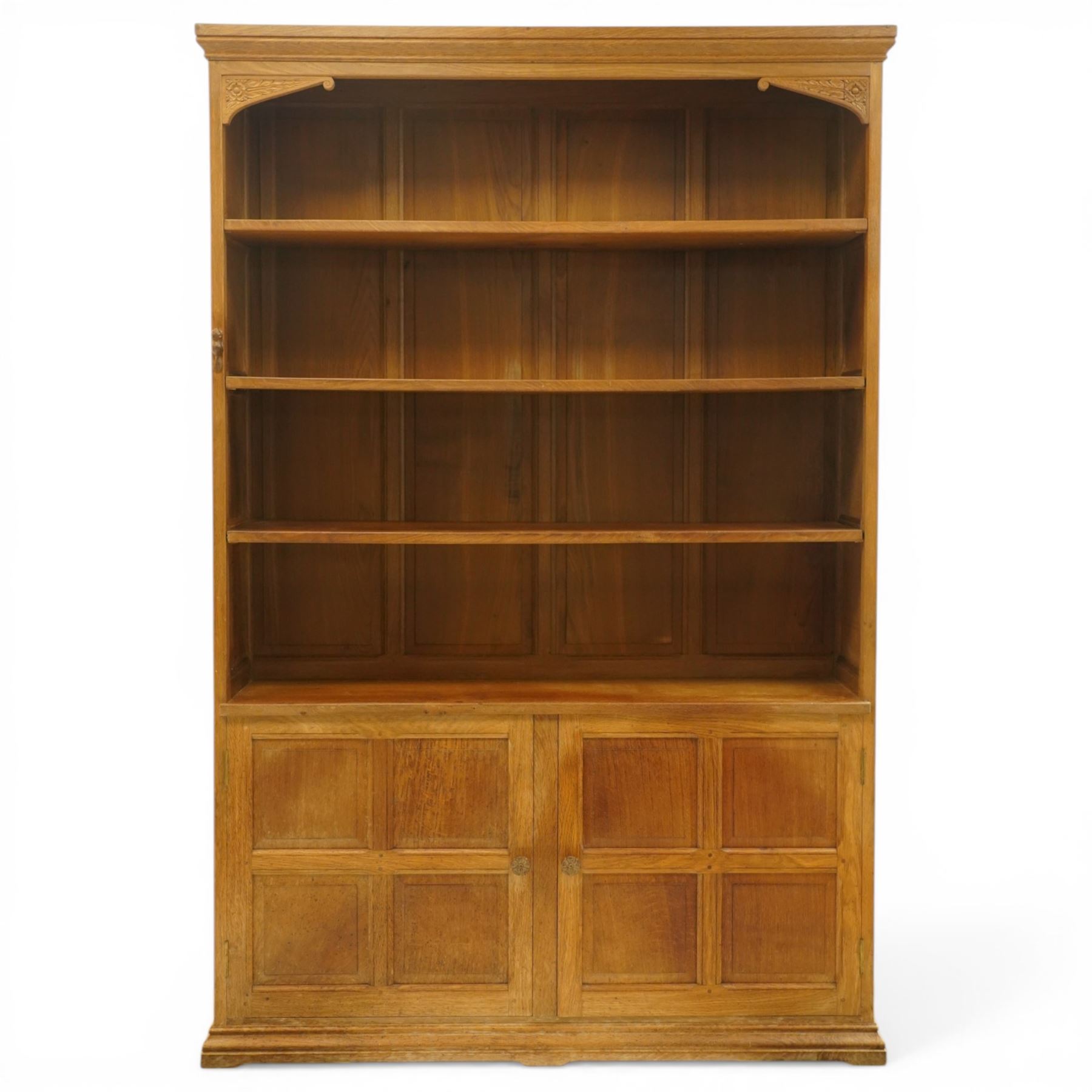 Beaverman - Yorkshire oak open bookcase, with adjustable shelves, panelled sides and lower cupboard doors, with carved beaver signature, by Colin Almack of Sutton near Thirsk