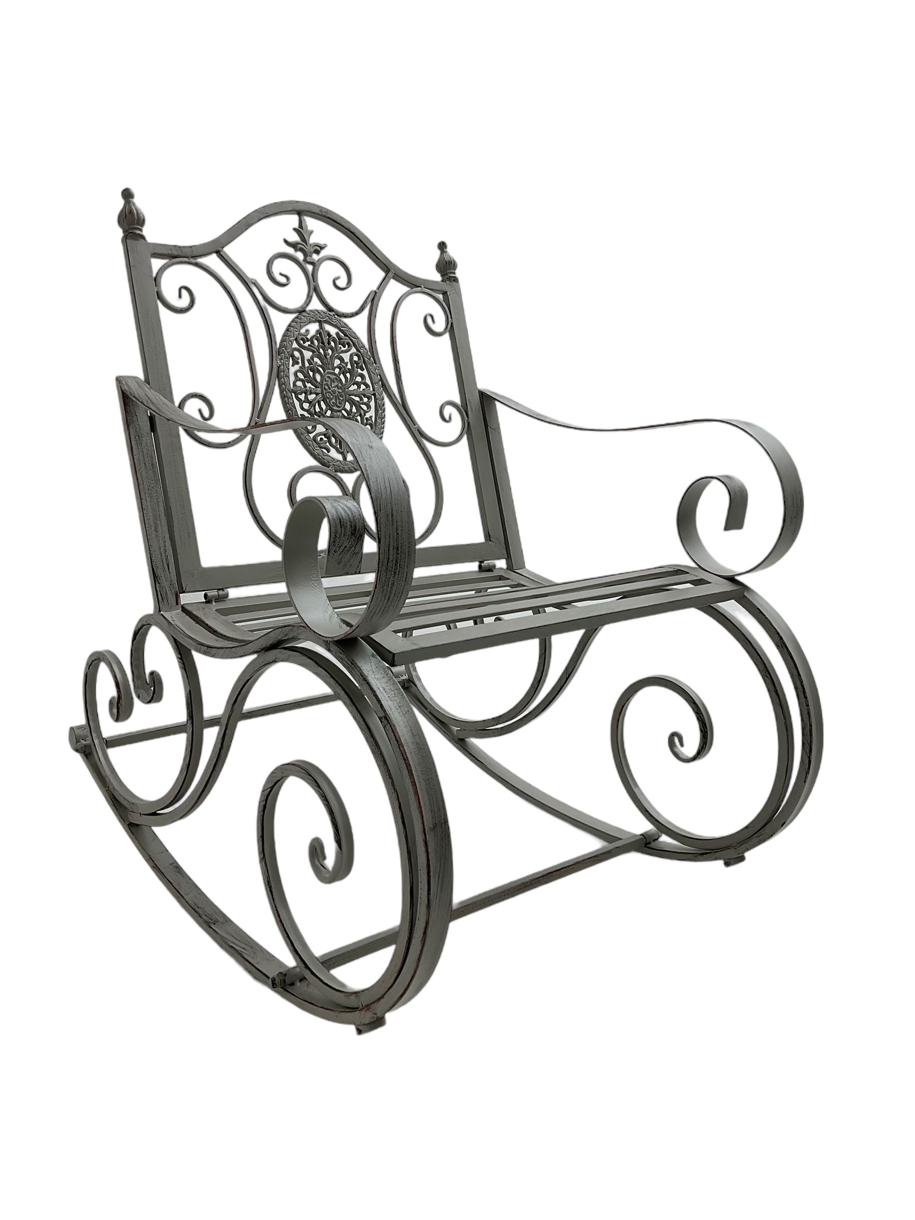 Regency design wrought metal rocking garden bench armchair, pierced back with scroll design and central foliate medallion over strap seat, with C-scroll arms and supports, in antique grey finish