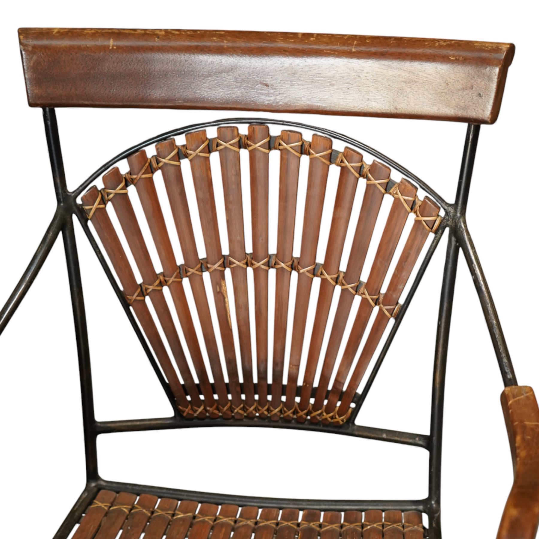 Contemporary circular green marble bistro table, raised on a black metal tubular base with decorative slatted collar, with two coordinating metal and wood slatted chairs