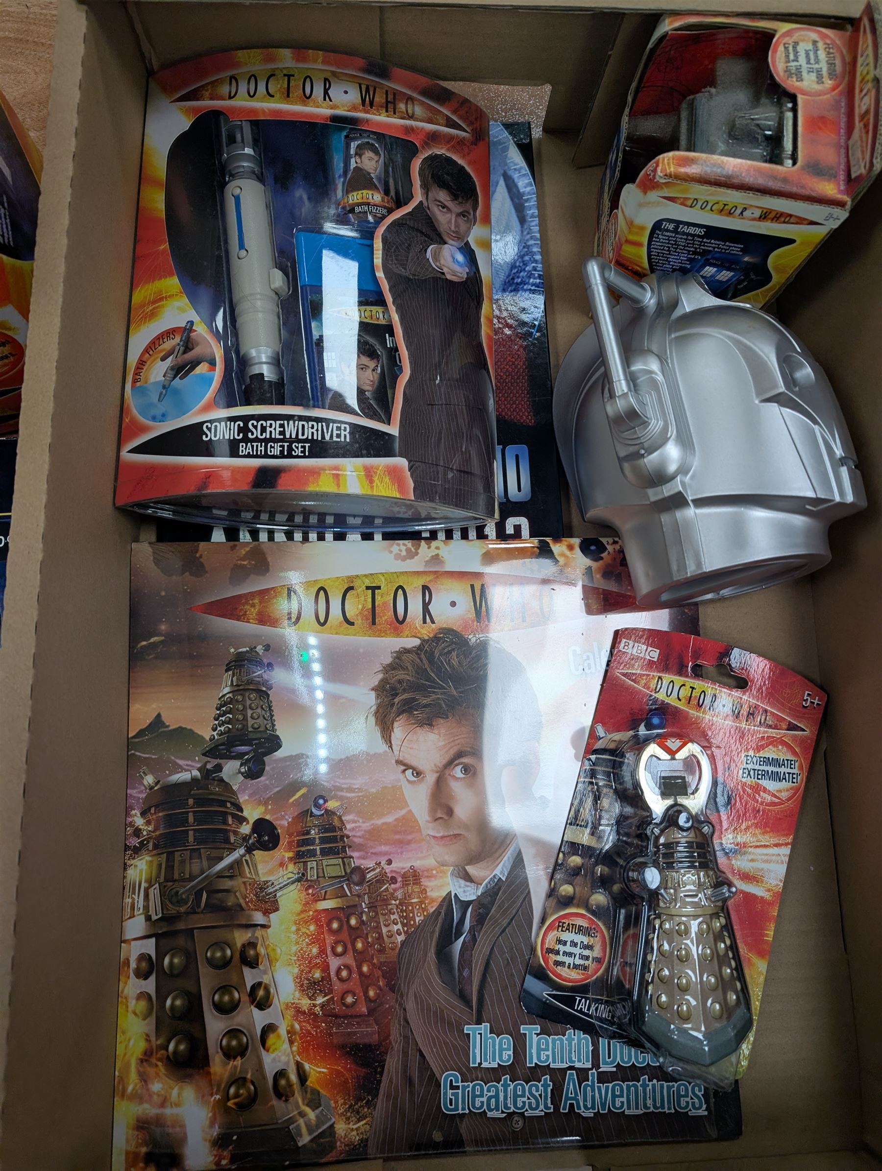 Doctor Who collectables, including Tardis Money Bank, Hologram Chamber, Bottle Opener, Cyber Man money box, calendar, annual, etc