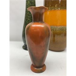 Burmantofts Faience vase, with elongated neck, and concentric circle decoration, in a green lustre glaze, together with a Bretby figure, modelled as a cat with a ball of wool, a Bretby vase, with fluted rim, in orange/red glaze, frog jug and a large West German vase, tallest H38cm