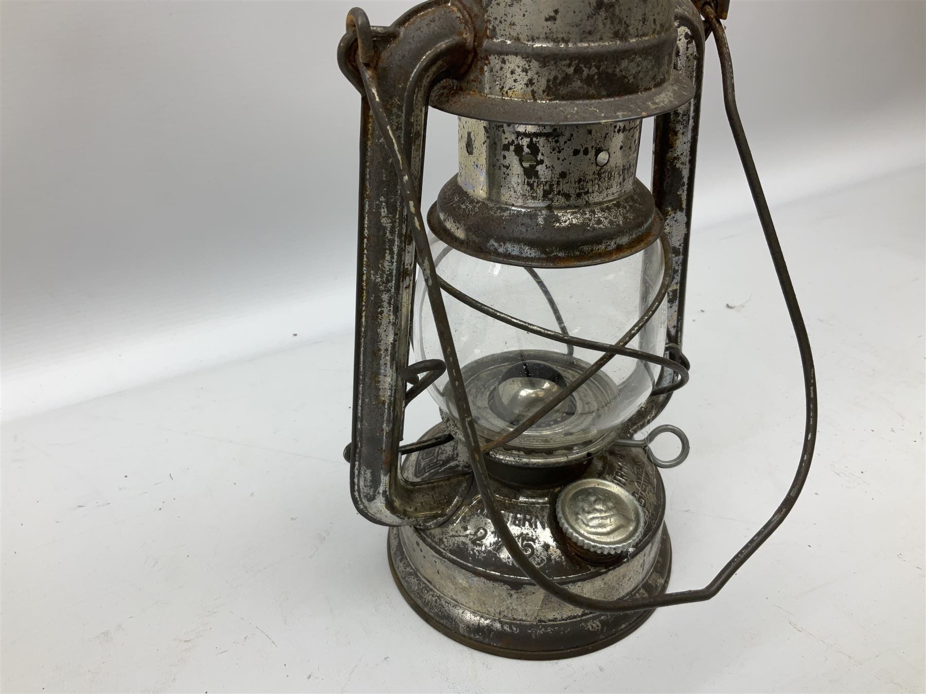 Copper and brass ship’s lamp marked ‘Anchor’, H25cm, Feuer hand storm lantern, Bialaddin Model 315 paraffin lamp and an Anchor lamp (4)