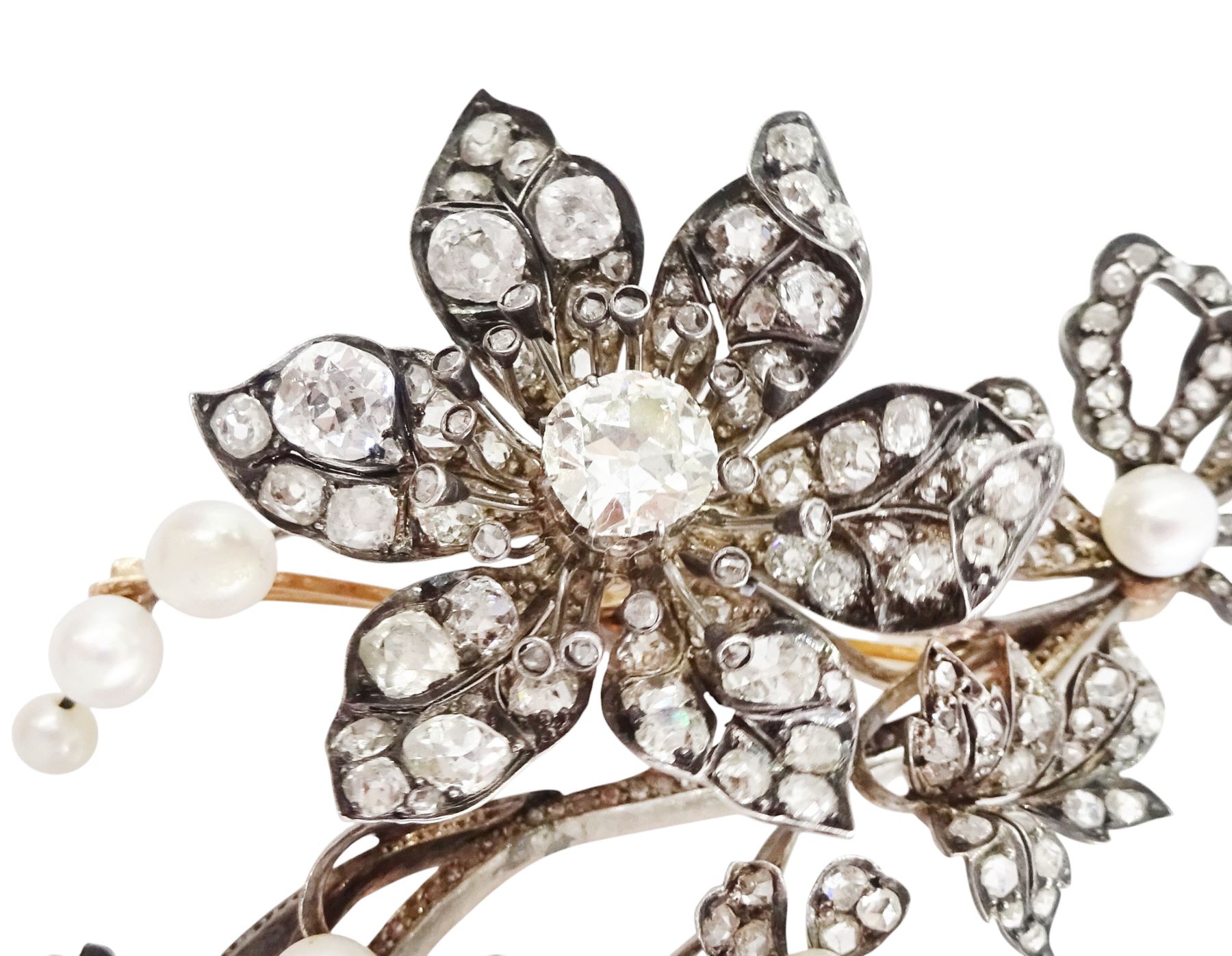 19th century gold and silver diamond and pearl en tremblant detachable brooch, the flower tremblant with a principal old cut diamond of approx 1.90 carat, the petals and stamen set with old cut and rose cut diamonds, total diamond weight approx 9.10 carat, to a foliate spray set set with further rose cut diamond and white / pink / cream pearls and ribbon tie