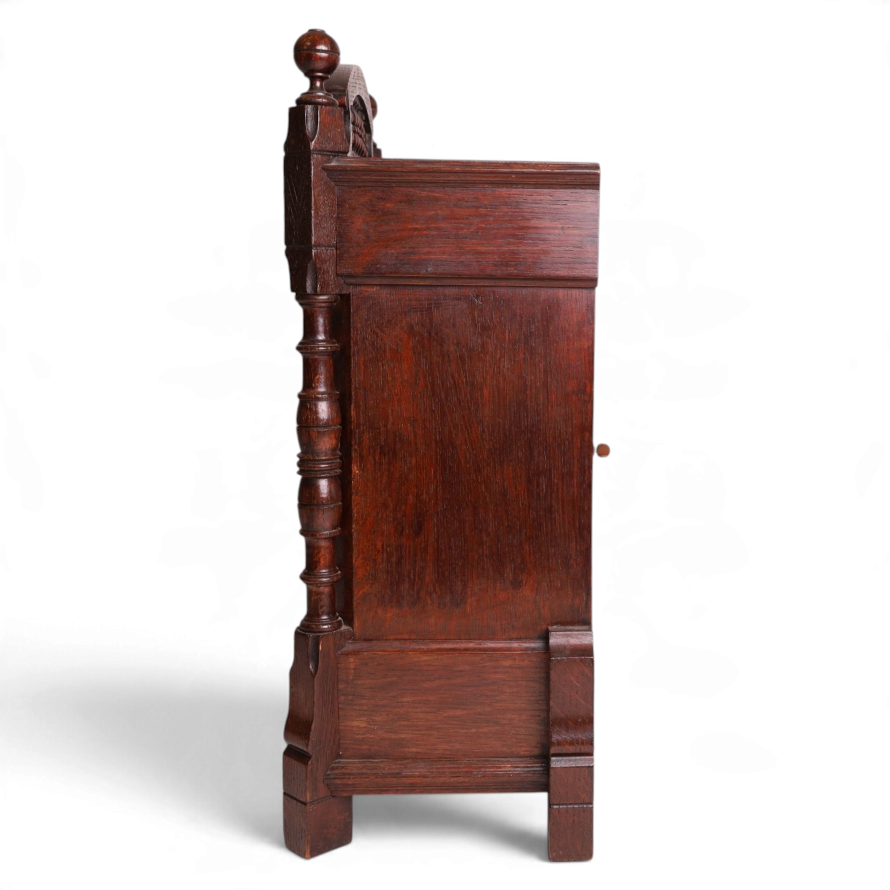 Aesthetic Movement mantel clock, in an oak case with turned detail and ceramic panels decorated with blue and white holly with berries, H48cm