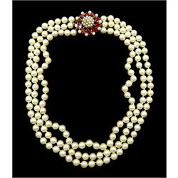 Triple strand cultured white/cream pearl necklace, with 9ct gold marquise cut garnet and pearl clasp