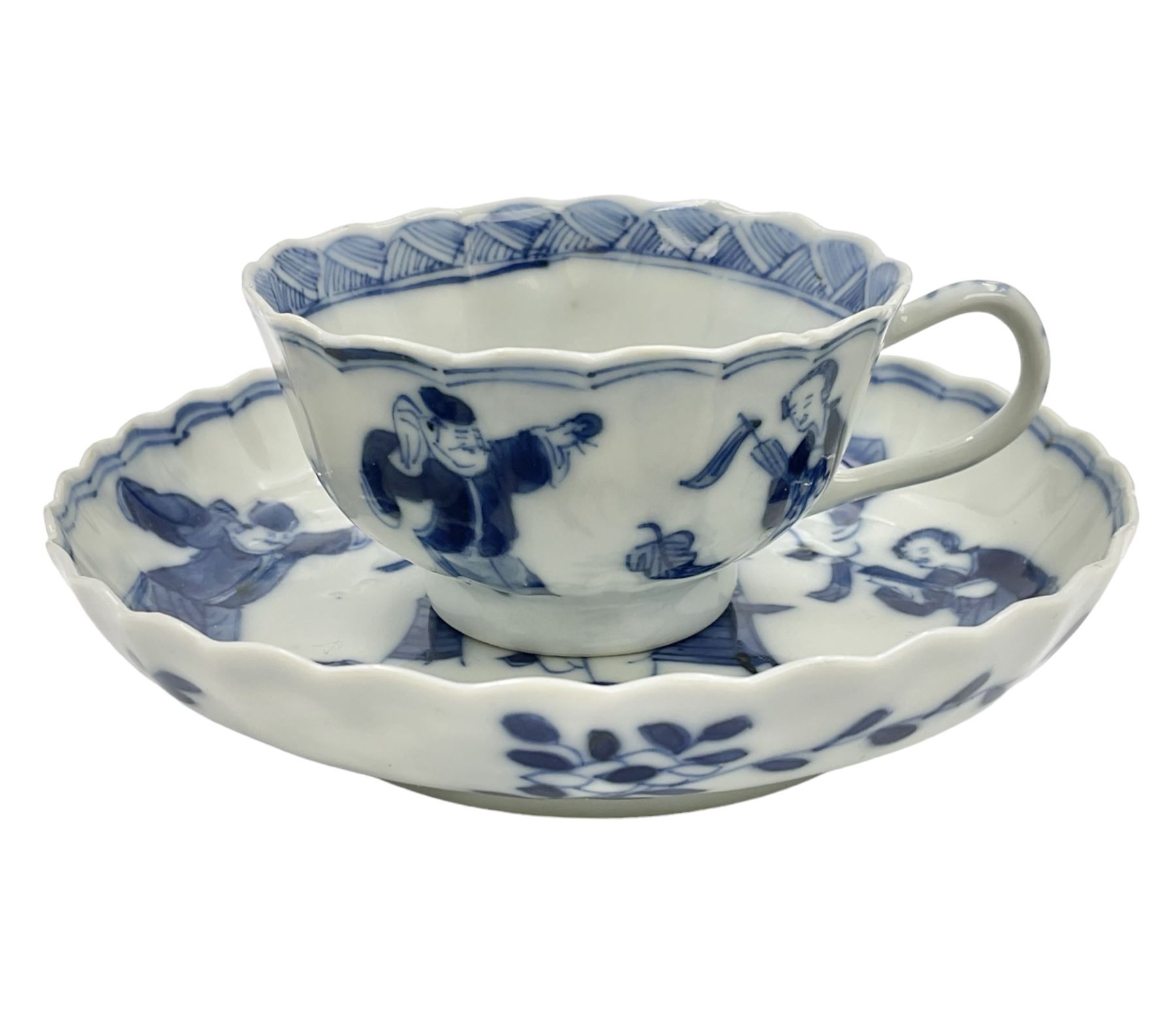 18th century Chinese blue and white Kangxi teacup and saucer, decorated with dancing figures, four character Kangxi mark beneath, saucer D10cm