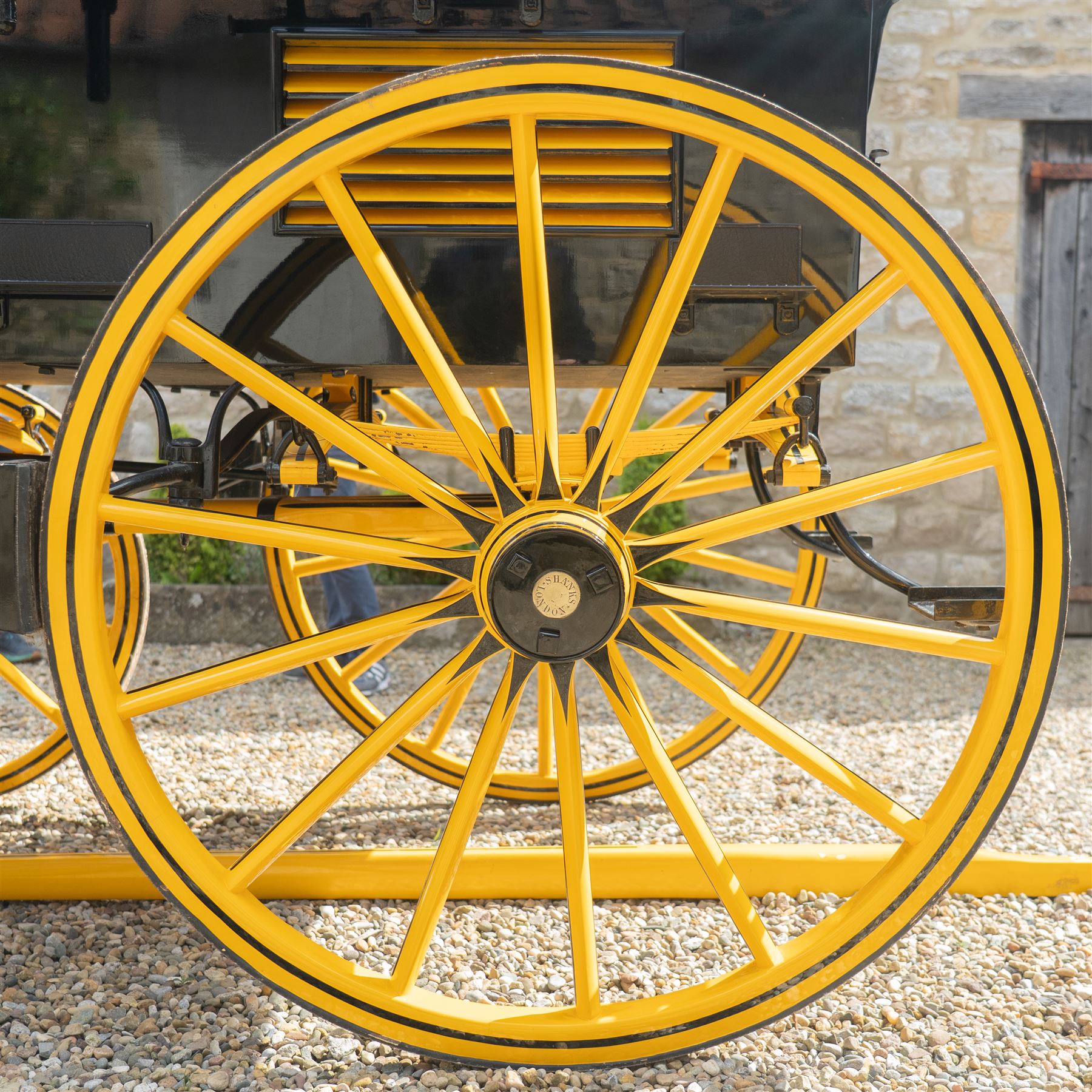 Roof Seat Break by Shanks of London

A roof seat break by Shanks of London built on a perch in black and yellow livery, the body fitted with an elevated driver's box seat, elevated rear groom's seat and central passenger compartment. The carriage is mounted on wooden spoked wheels with leaf spring suspension and is equipped with louvred underbody storage compartments, carriage lamp brackets (lamps next lot), folding access steps and a pole for driving with a pair or team of horses. The wheel hubs are stamped 