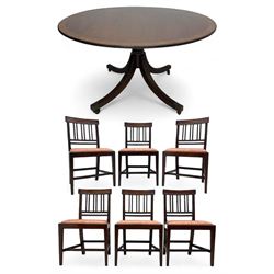 Early 20th century Regency design mahogany tilt-top table, circular top with edge banding, supported by a central turned pedestal with four reeded sabre supports terminating in castors; six chairs with pink upholstered drop in seats (7)