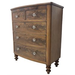Victorian mahogany bow front chest, fitted with two short over three long graduating cock-beaded drawers, each with glass handles, raised on turned feet