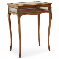 Louis XV revival style walnut bijouterie table, rectangular serpentine form, with brass edging and a hinged floral marquetry inlaid lid with bevelled glass top and sides, gilt-bronze beaded border, interior lined with rich red velvet, raised on slender cabriole legs with gilt bronze masks and sabots, circa 1900