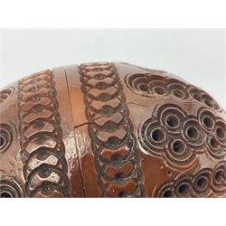 Three 19th century coquilla nut pomanders or flea catchers, two of egg shaped form and the third of barrel from with carved and pierced decoration and screw threaded join, largest H8cm