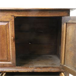 18th century oak hall cupboard, rectangular top with moulded edge, over two panelled hutch-cupboards, the base fitted with six assorted drawers, on large bracket feet