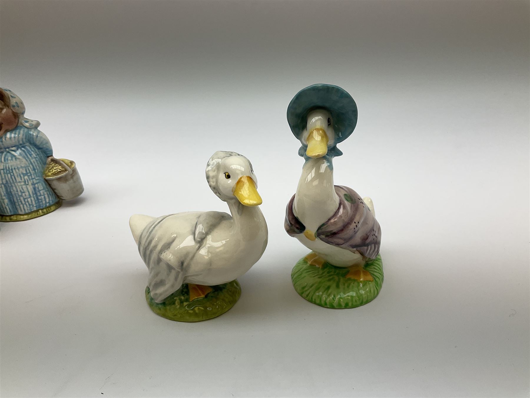 Fifteen Beswick Beatrix Potter figures, comprising Tommy Brock, The Old Woman who live in a Shoe, Samuel Whiskers, Foxy Whiskered Gentleman, Old Mr Brown, Mr Benjamin Bunny and Peter Rabbit, Tailor of Gloucester, Goody Tiptoes, Mr Benjamin Bunny, Diggory Diggory Delvet, Jemima Puddleduck, Aunt Pettitoes, Hunca Munca, Rebeccah Puddle-Duck, and Lady Mouse. 