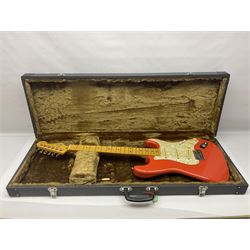 Japanese Squier Fender 'Hank Marvin' Stratocaster electric guitar, c1992, in Fiesta red with tremolo arm and facsimile signature decal; serial no.L037281, L98cm; in hard carrying case.