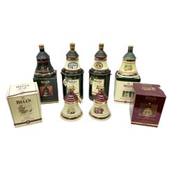 Six Bell's Old Scotch Whisky Christmas ceramic decanters comprising 1988, 1989, 1992, 1996, 1997 and 1998 all in original boxes and decanter seals intact 
