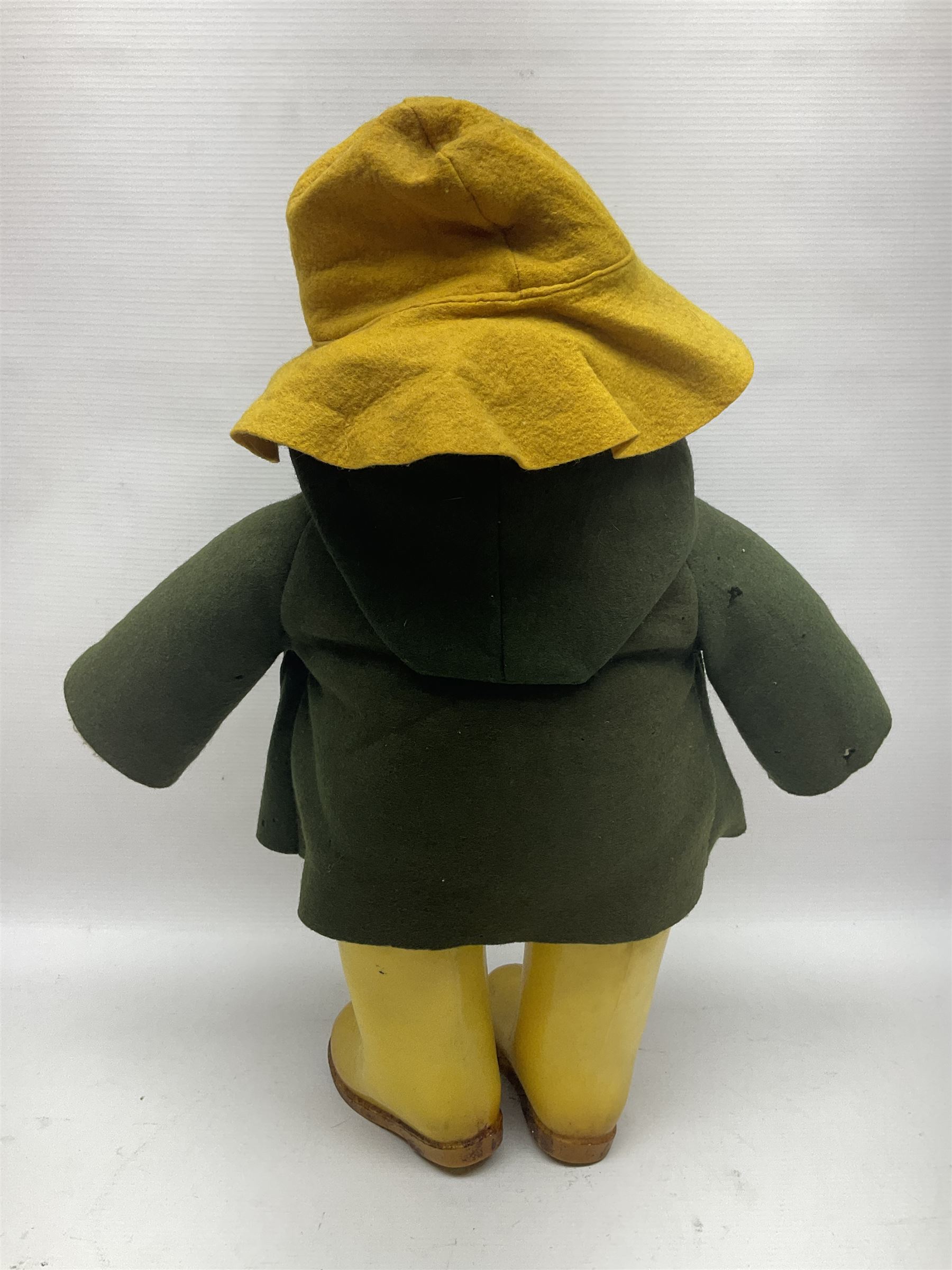 Vintage Paddington Bear teddy with yellow felt hat, green coat and yellow Dunlop boots, H48cm