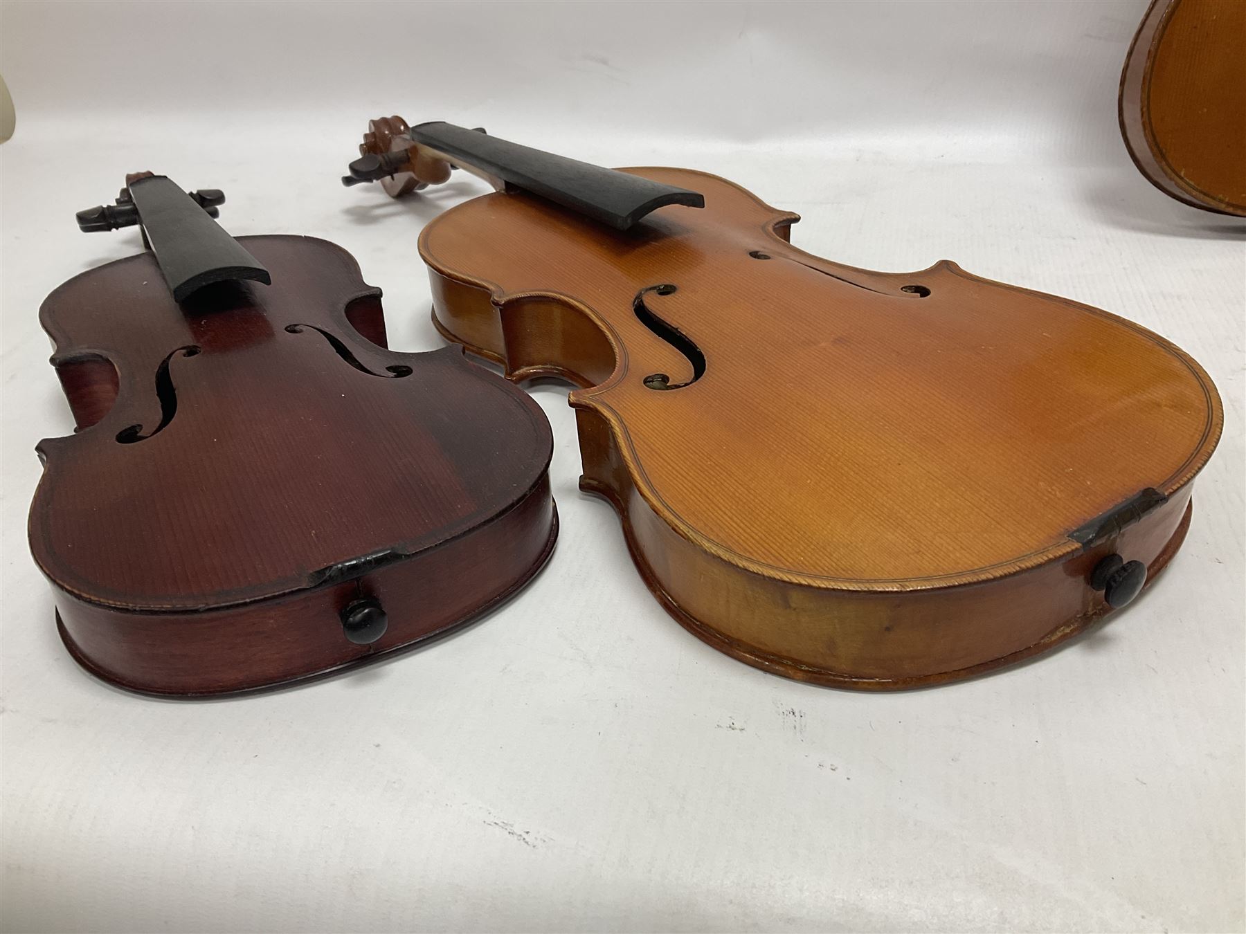 Four violins 1/8th size; half size with Nicolas Bertholini label; three-quarter size with Stradivarius copy label; and full size with Marquis De L'Air label (4)