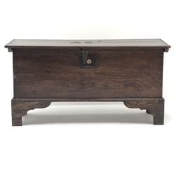 Small George lll planked oak coffer, hinged top with chip carved sides and brass nailed initials AE, on shaped bracket feet, W83cm, D32cm, H42cm  
