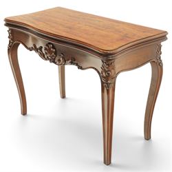 Victorian carved mahogany card table, shaped rectangular top with hinged fold-over top enclosing baize lined interior, supported on rear draw-supports, the frieze carved with anthemion and acanthus leaves, on cabriole legs