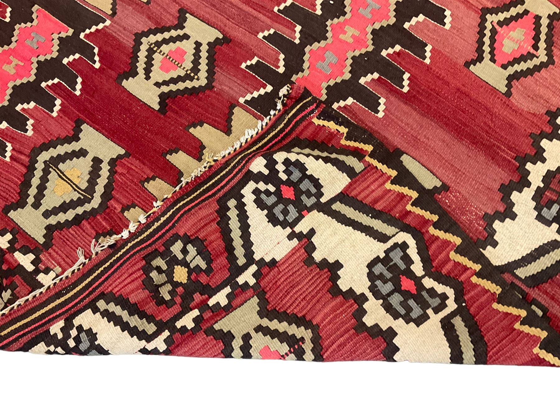 Large  red ground Kilim rug or wall hanging, decorated with geometric patterns and dated within the weave '1969'