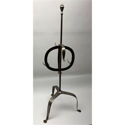 Early 19th century steel lark spit, circa 1800-1820, with rise and fall action panel with six prongs, upon tripod legs, H81cm